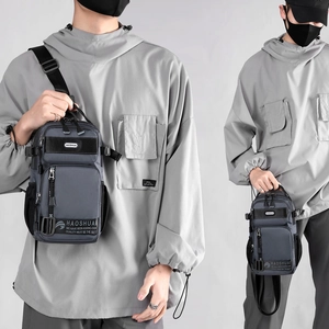 Men's minimalist gray nylon crossbody chest bag with adjustable black shoulder strap