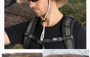 Detail of khaki wide-brim sun hat with adjustable wind cord and tactical backpack