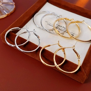Classic gold and silver minimalist geometric hoop earrings with polished mirror finish