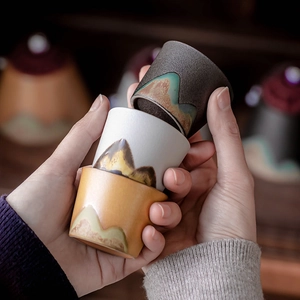 Japanese style ceramic teacups set with mountain pattern in diverse glazed finishes