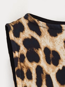 Detailed close-up of leopard print fabric showing stitching and texture for summer dress
