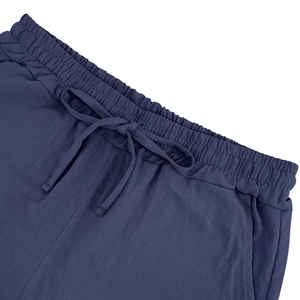 Detail of navy blue drawstring elastic waistband on breathable linen summer shorts