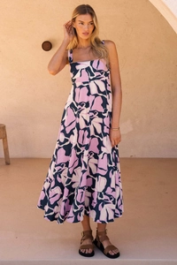 Detailed texture of purple abstract floral print on summer maxi dress with soft pleats