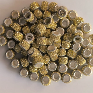 Close-up of sparkling yellow crystal clay beads with 5mm silver metal large hole eyelets