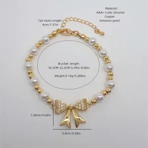 Adjustable 18K gold plated bowknot bracelet with faux pearls and sparkling cubic zirconia