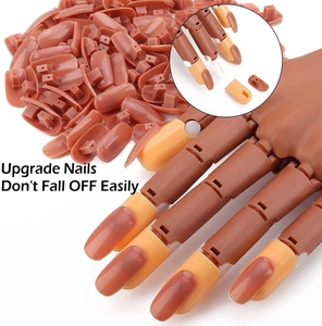 Close-up of brown nail tips with secure buckle design for mannequin practice hands