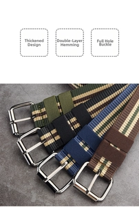 Detail of four colorful striped canvas belts with polished silver steel buckles