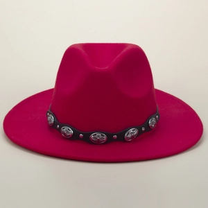 Detailed view of magenta wool fedora hat with black leather belt and silver metal buckles