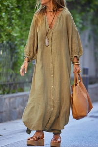 Close-up of olive green cotton linen maxi dress with button-down detail and V-neckline
