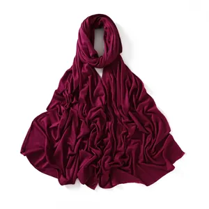 Detail of burgundy jersey hijab showing soft mercerized cotton texture and fine stitching