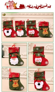 Detail of four festive Christmas stockings with 3D Santa, Snowman, Bear and Reindeer motifs