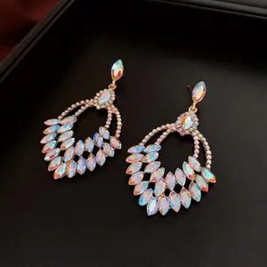 Luxurious vintage golden pear-shaped drop earrings with iridescent AB rhinestones
