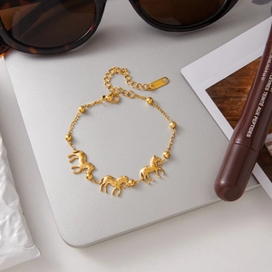 Elegant 18k gold plated stainless steel bracelet featuring zebra charms and round beads