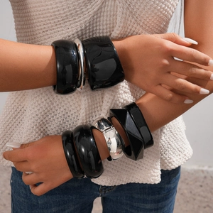 Modern chunky resin and silver metal bangles set with geometric patterns for women