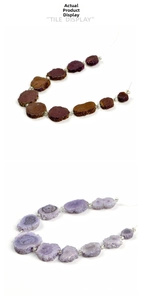 Vertical view of natural purple crystal flower slices with irregular mineral texture