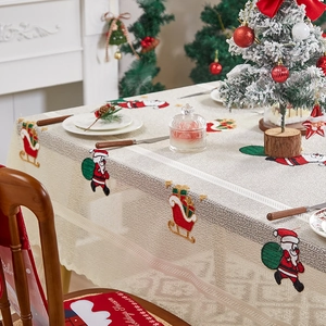 Festive Santa Claus embroidered tablecloth with matching red holiday season chair covers
