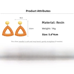 Detail view of resin triangle earrings with dimensions 5.6cm and weights of 14g