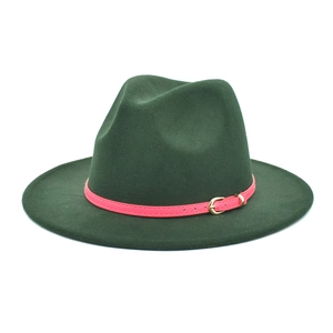 Detail of dark green wool fedora hat featuring a bright pink belt and gold buckle