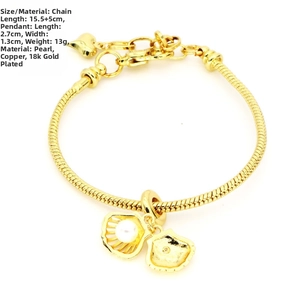 Detail of 18K gold plated bracelet with shell charms and pearl showing length 15.5+5cm