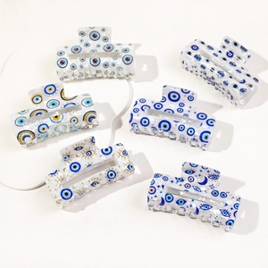 Detailed set of six rectangular hair claw clips with colorful evil eye patterns
