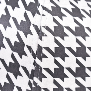Detailed view of the houndstooth pattern and durable stitching on a baseball cap