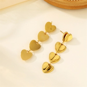 Detail of 18k gold plated double layer heart tassel earrings with four connected hearts