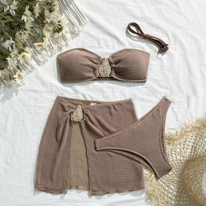 Detailed view of coffee-colored waffle knit bikini set with gold teardrop metal hardware