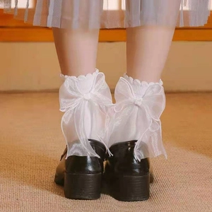 Elegant white lace crew socks with large silk ribbon bows on heels for a chic JK style look