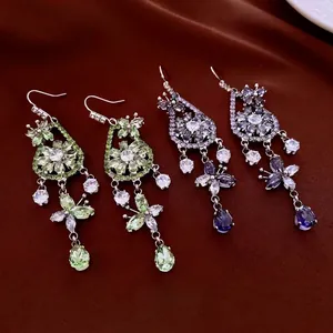 Elegant zircon flower butterfly drop earrings with long tassels on dark silk background