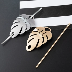 Monstera leaf hair pin set in gold and silver finish with brushed metal texture