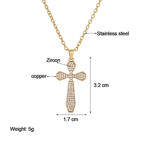 Detailed view of gold cross pendant with cubic zirconia and copper dimensions 3.2x1.7cm