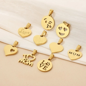 Detailed view of 18K gold-plated stainless steel heart and round charms with engravings