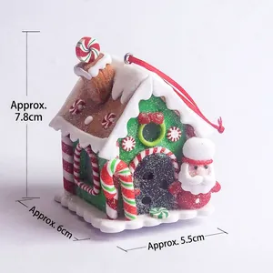 Detailed view of glowing clay gingerbread house with Christmas elements and size dimensions