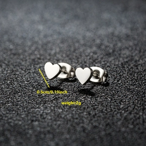 Polished silver heart stud earrings with 0.5cm diameter and 2g weight details