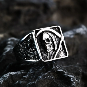 Close-up of vintage stainless steel grim reaper skull ring with gothic wing details