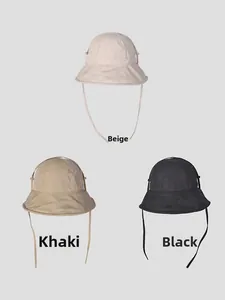 Three bucket hats shown in beige, khaki and black with adjustable chin straps