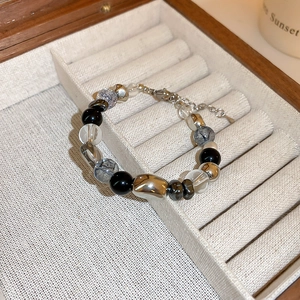 Dark style beaded bracelet with black hematite and crystal beads on velvet display