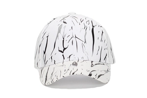 Detailed close-up of a white baseball cap featuring modern black marble texture design