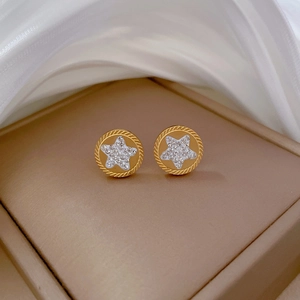 Gold round stud earrings with woven texture, white star inlay and sparkling rhinestones