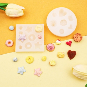 Silicone donut and candy molds set for DIY resin crafting and baking decor on orange background