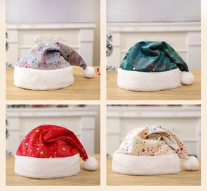 Detail of soft Christmas hats with colorful star sequins in red, green, silver, and beige