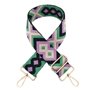 Close-up of diamond pattern woven bag strap with adjustable gold metal buckle hardware