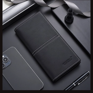Close-up of black leather long wallet with litchi texture and precise white stitching
