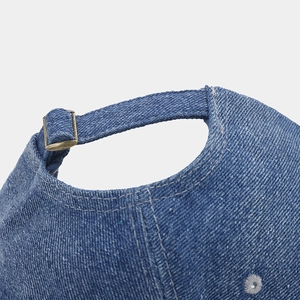 Classic blue denim baseball cap featuring an adjustable metal buckle and retro strap