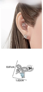 Detail showing bow-shaped stud earring with heart zircon and product dimensions