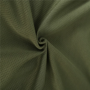 Macro shot of army green quick-dry mesh fabric showing breathable honeycomb texture