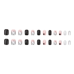 Short square press-on nails with black glitter, stars, and silver gradient details