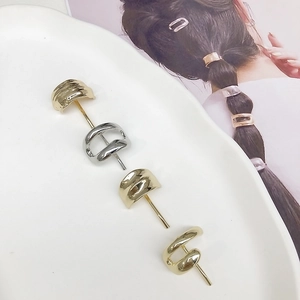 Set of four minimalist metal hair hooks in gold and silver with a hammered texture finish