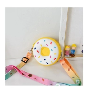 Detail view of donut silicone purse with rainbow strap and colorful sprinkles for kids