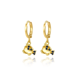 Detail of gold hoop earrings featuring yellow fish pendants with blue crystal accents